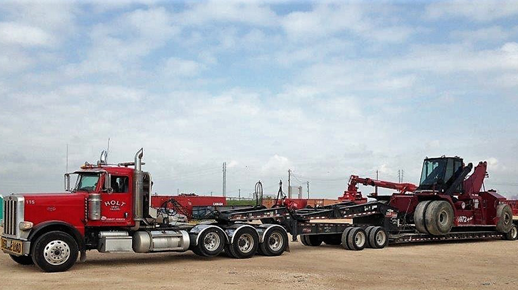 Truck Hauling Heavy Machinery