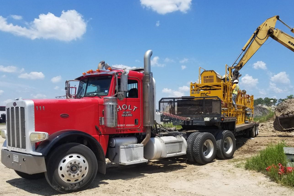 Truck Hauling Heavy Equipment 